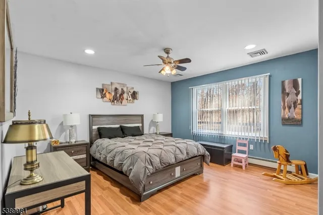 a bedroom with a bed and a table in it