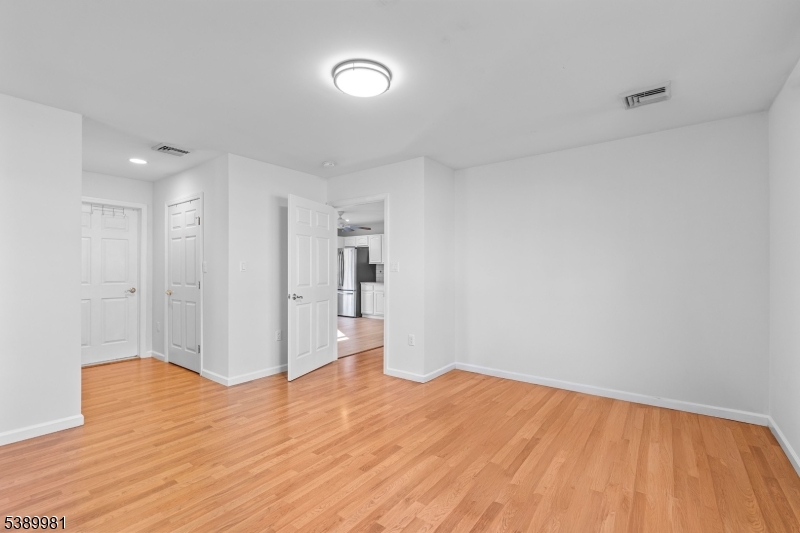 379 East Bird Village Road Jackson, NJ 08527 - Photo 31 of 38 a view of empty room with wooden floor