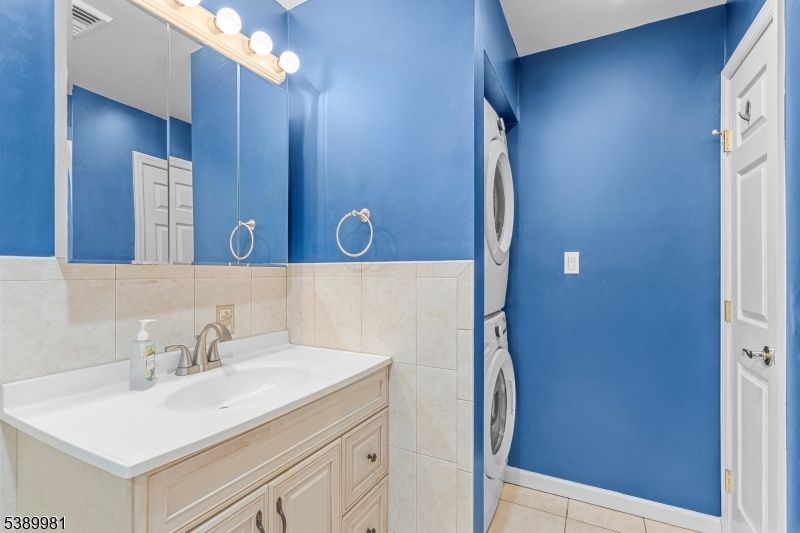 379 East Bird Village Road Jackson, NJ 08527 - Photo 33 of 38 a bathroom with a sink vanity and a mirror