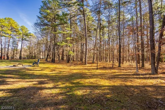 a view of a swimming pool with an outdoor space and seating area