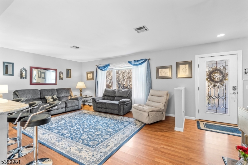 379 East Bird Village Road Jackson, NJ 08527 - Photo 8 of 38 a living room with furniture and wooden floor
