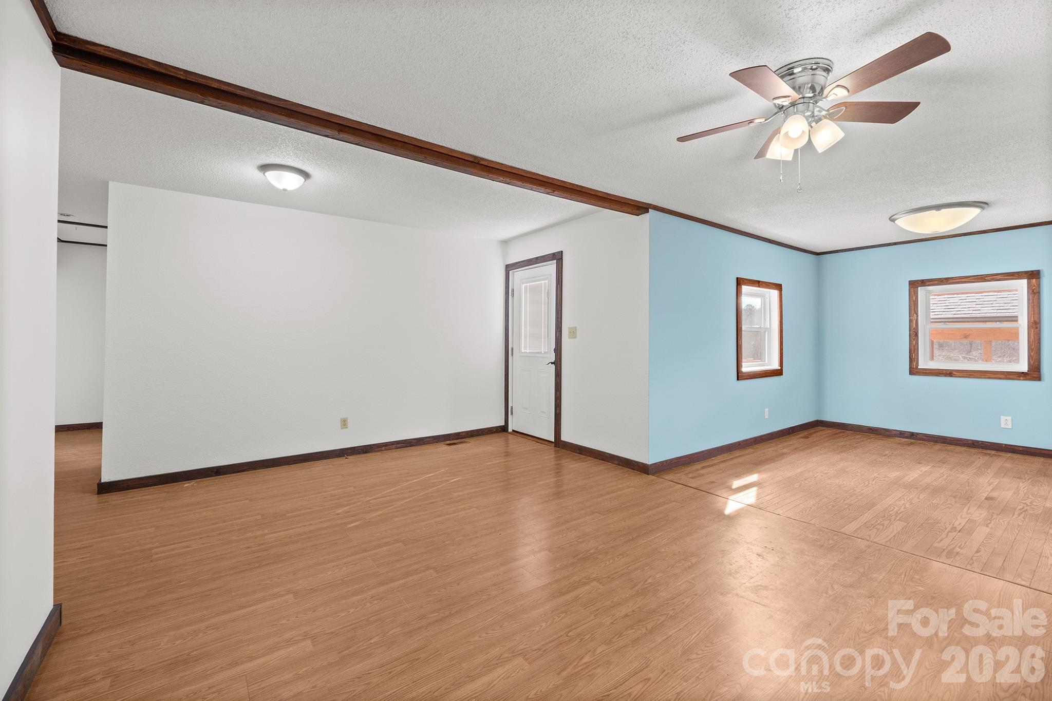 7400 Corn Hill Road Connelly Springs, NC 28612 - Photo 10 of 41 wooden floor in an empty room with a window