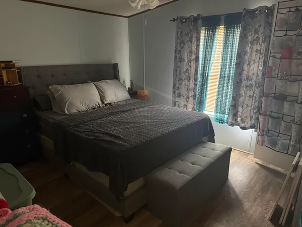 a bedroom with a bed and a couch