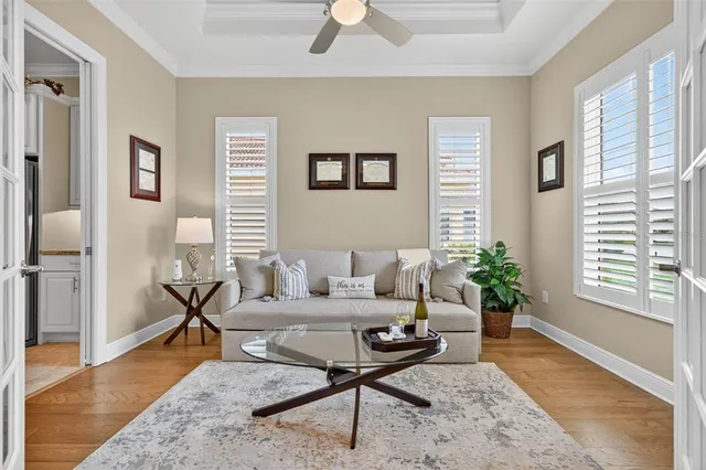 a living room with furniture white walls and a fireplace