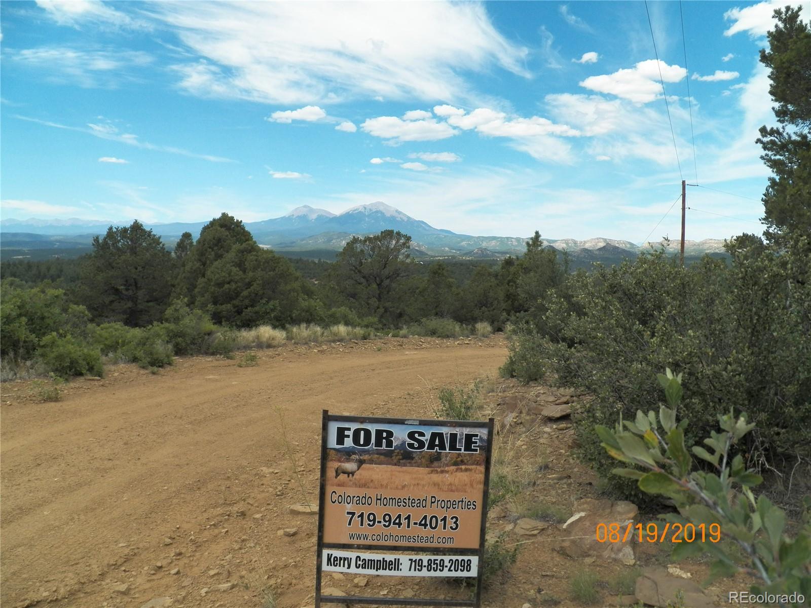 47 Peakview Road Trinidad, CO 81082 - Photo 2 of 18 a view of sign board with lake and trees