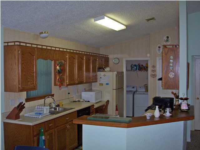 801 Cloverview Drive Crestview, FL 32536 - Photo 2 of 2 a bathroom with a sink and a mirror