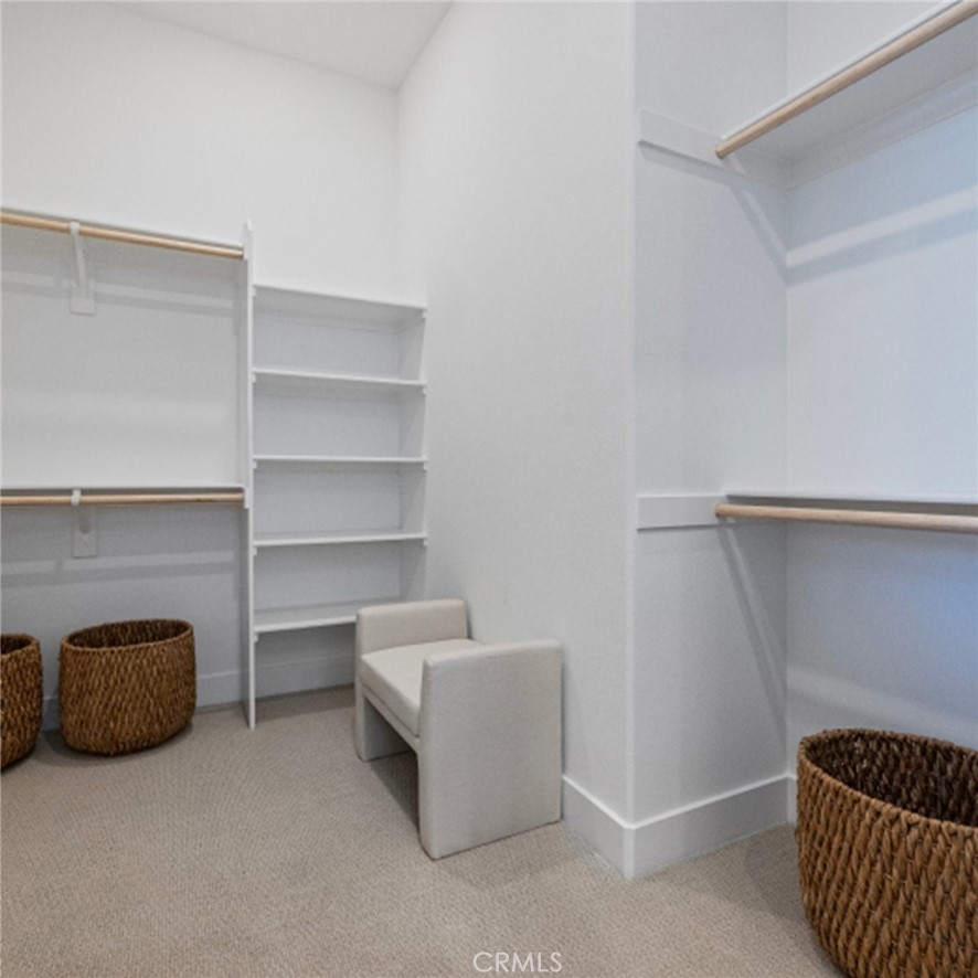 110 Seep Irvine, CA 92618 - Photo 13 of 33 a room with a walk in closet and cabinets