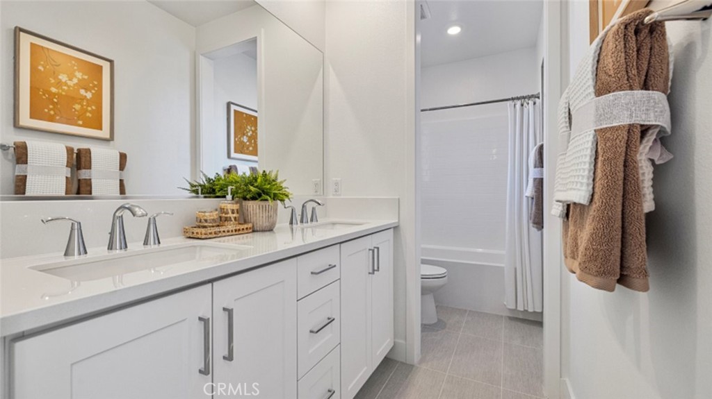 110 Seep Irvine, CA 92618 - Photo 15 of 33 a bathroom with a granite countertop sink toilet and shower