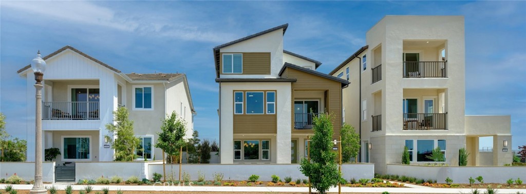 110 Seep Irvine, CA 92618 - Photo 23 of 33 a view of a brick house with large windows and plants