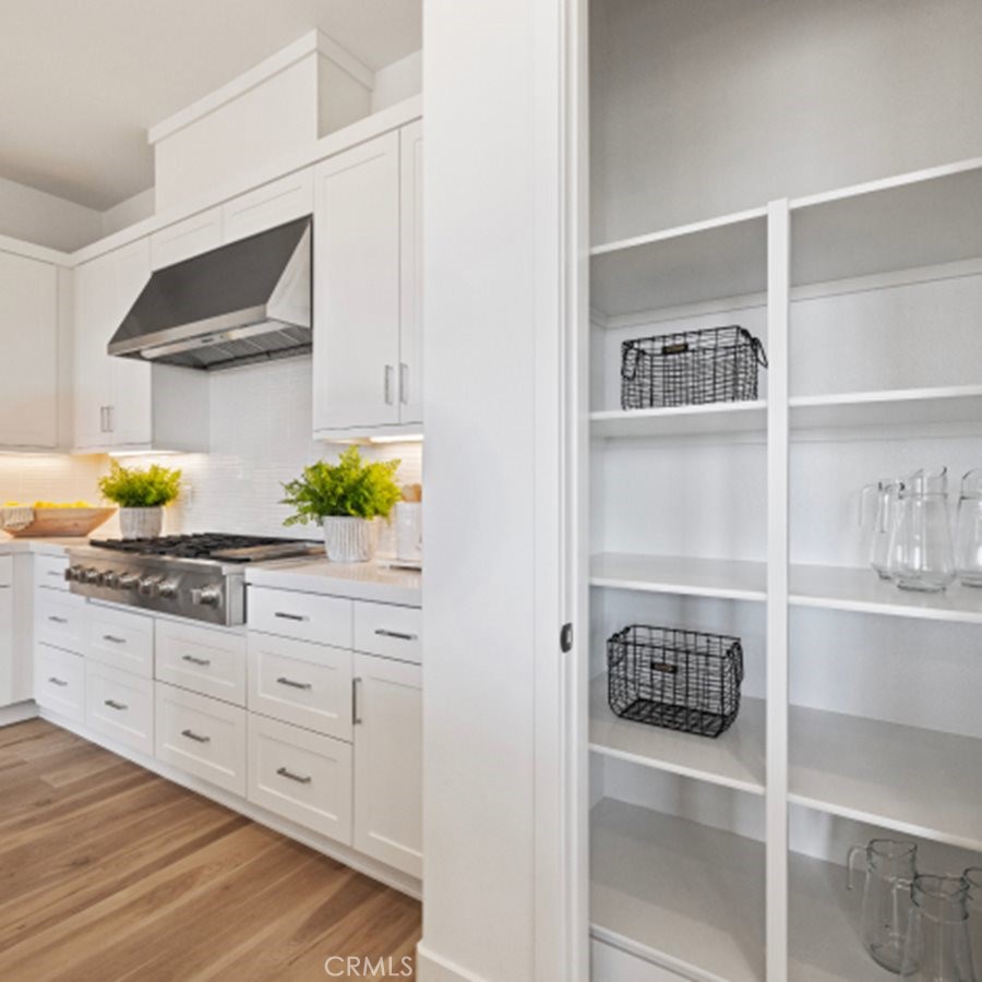 110 Seep Irvine, CA 92618 - Photo 4 of 33 a kitchen with white cabinets and appliances