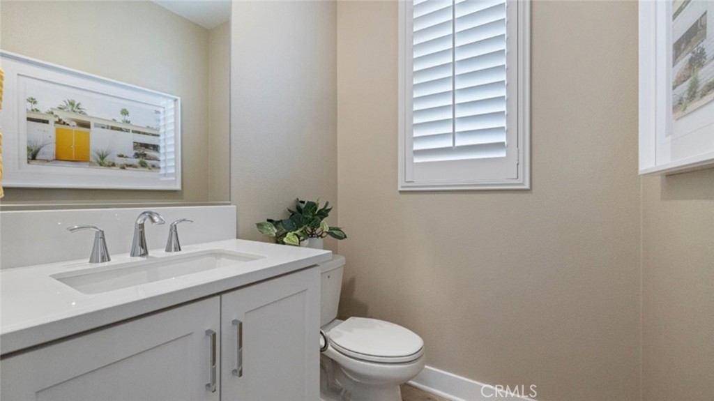 110 Seep Irvine, CA 92618 - Photo 9 of 33 a bathroom with a toilet a sink and a window