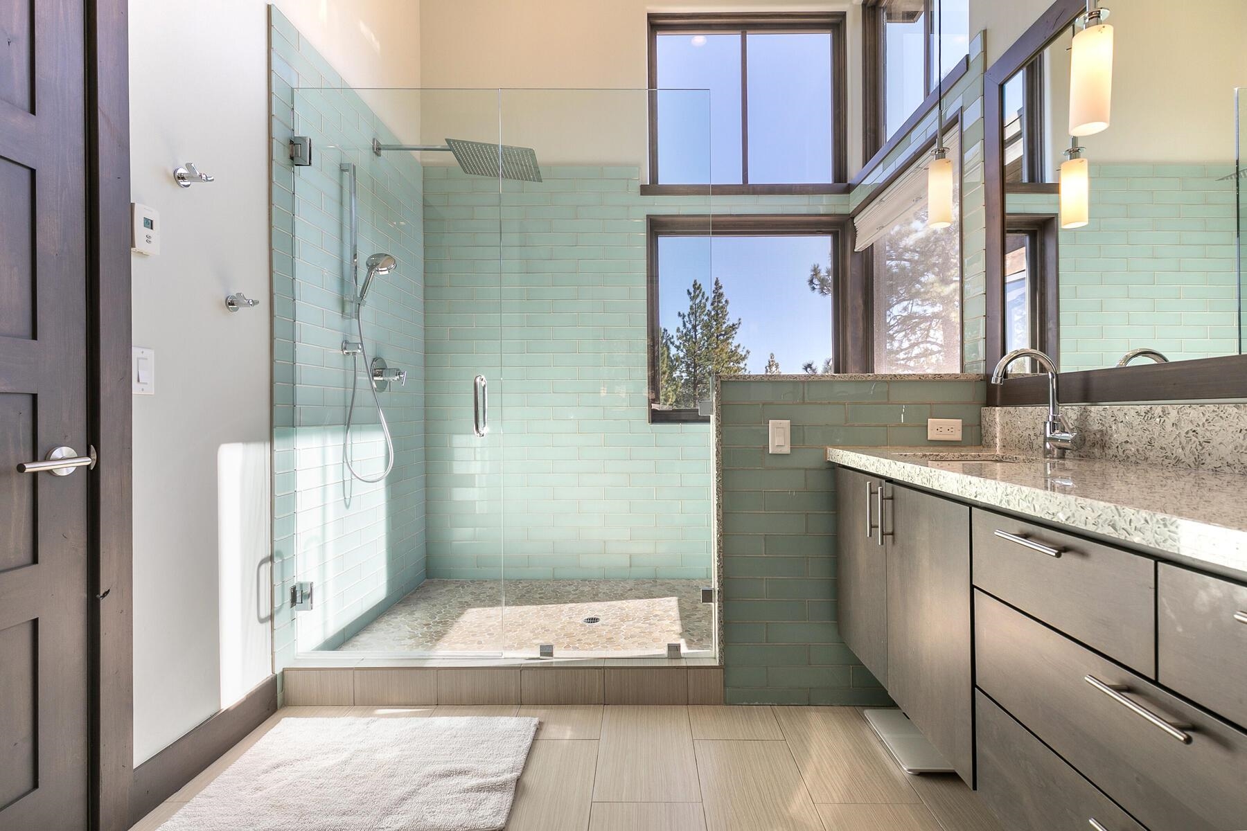 11863 Coburn Drive Truckee, CA 96161 - Photo 15 of 21 a bathroom with a granite countertop shower a sink and a mirror