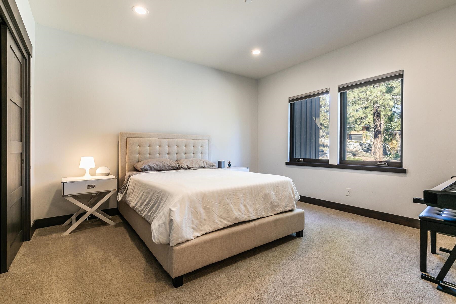 11863 Coburn Drive Truckee, CA 96161 - Photo 16 of 21 a spacious bedroom with a bed and a window