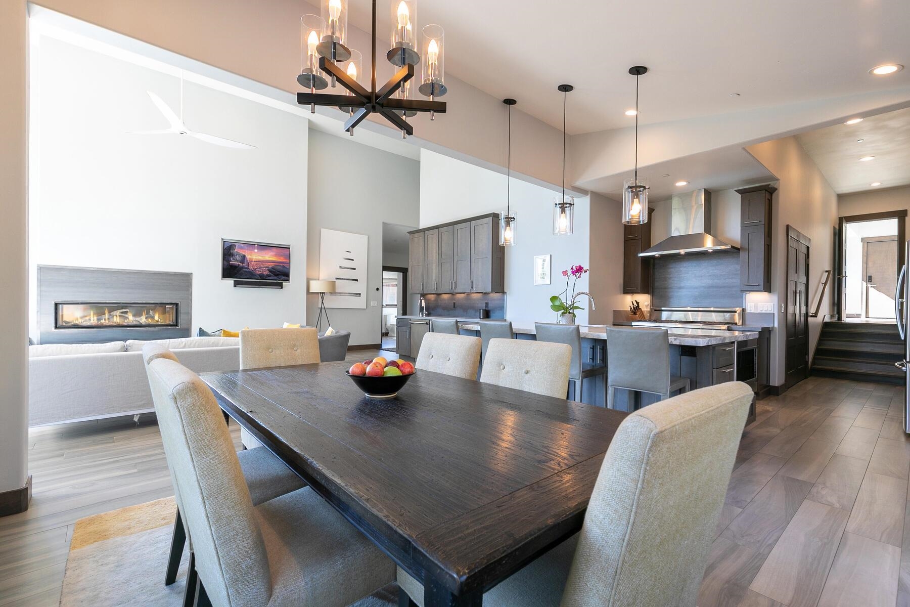 11863 Coburn Drive Truckee, CA 96161 - Photo 6 of 21 a kitchen with stainless steel appliances granite countertop a dining table chairs and chandelier