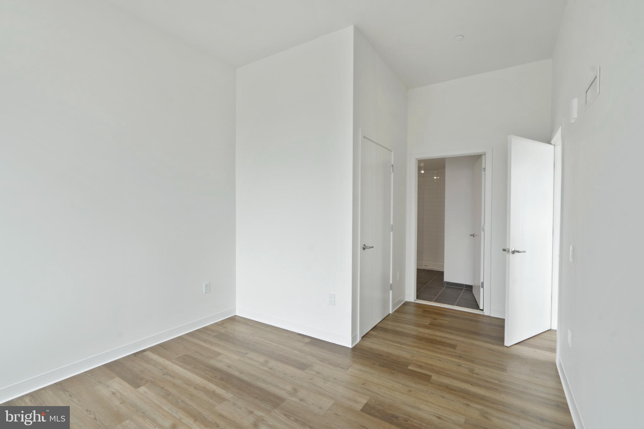 569 North 5th Street, Unit 902 Philadelphia, PA 19123 - Photo 12 of 49 a view of an empty room and wooden floor