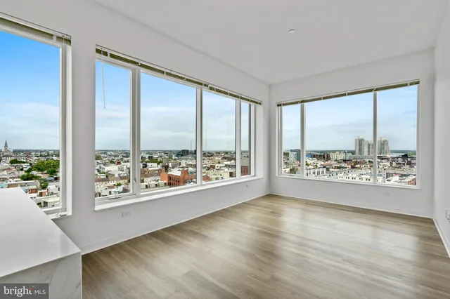 a view of an empty room and a window