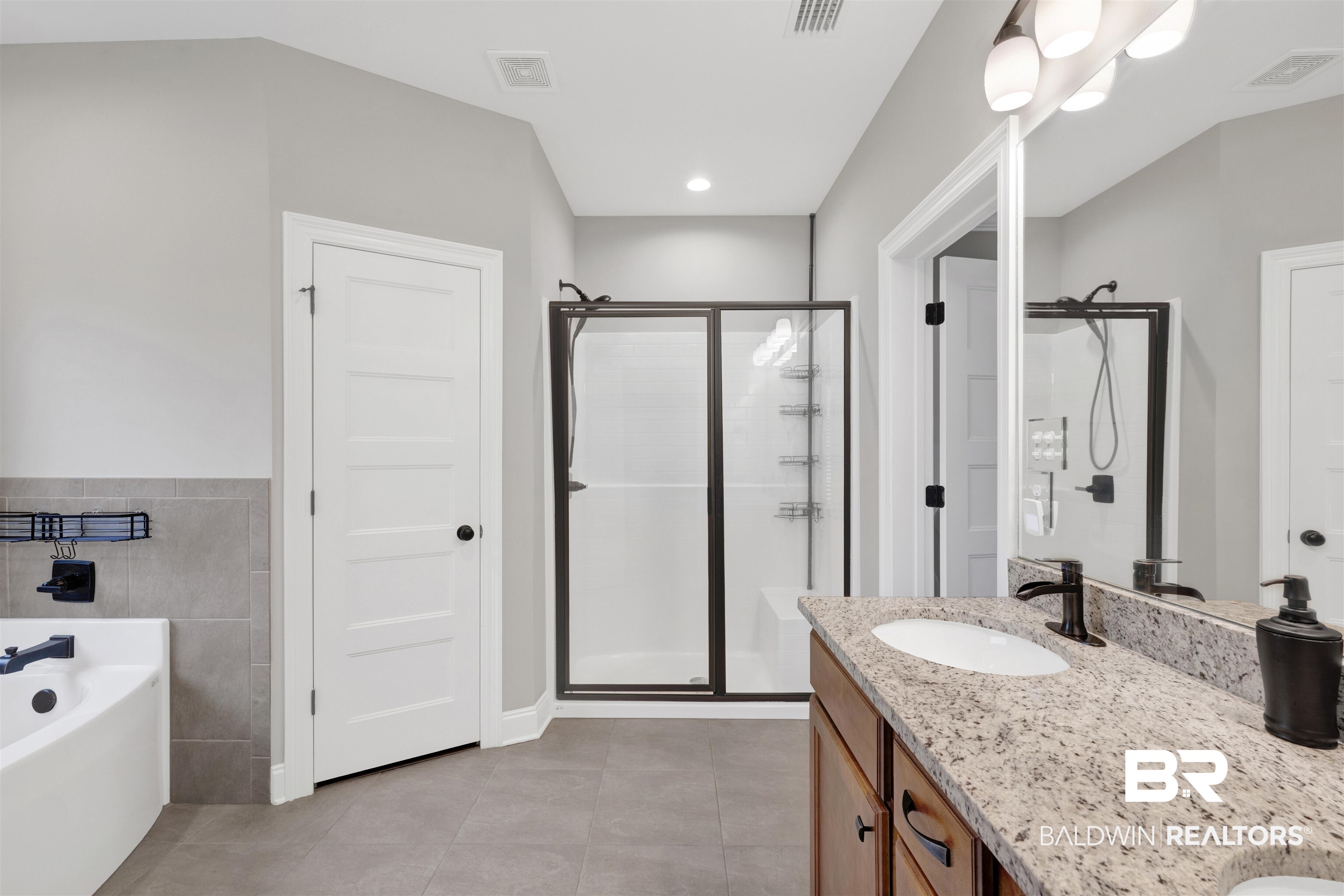 12672 Squirrel Drive Daphne, AL 36527 - Photo 26 of 49 Modern bathroom with a granite-topped vanity featuring a single undermount sink