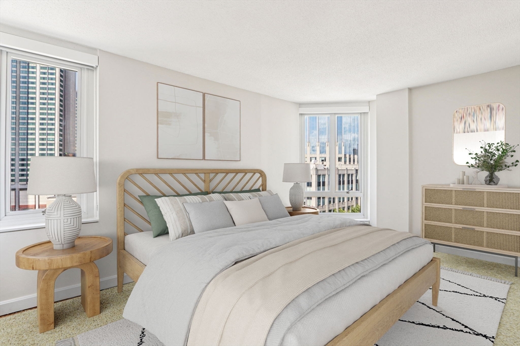 a bedroom with a large bed and a window