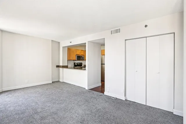 a view of a kitchen with a dishwasher and a refrigerator