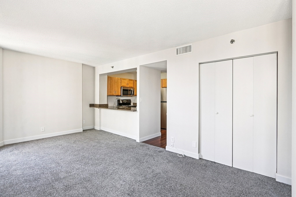 150 Huntington Avenue, Unit SM3 Boston, MA 02115 - Photo 4 of 6 a view of a kitchen with a dishwasher and a refrigerator