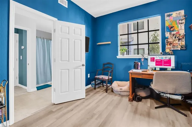 a living room with furniture and a window