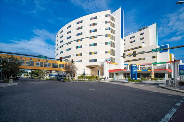 a city street lined with buildings and trees
