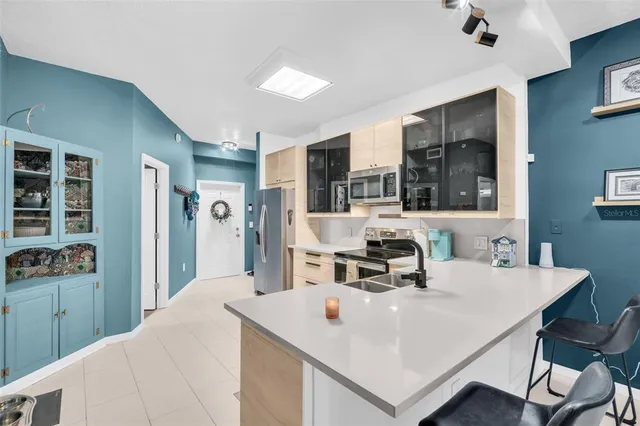 a view of kitchen island a sink and living room