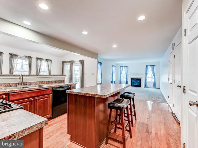 a kitchen with a stove and a refrigerator