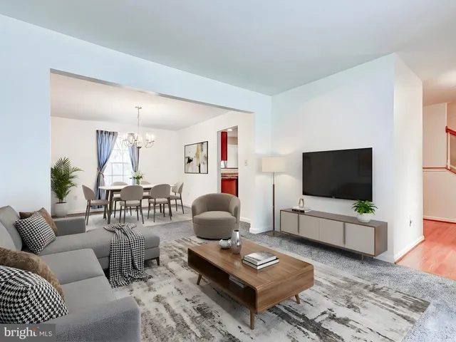 a view of a chandelier and window in an empty room