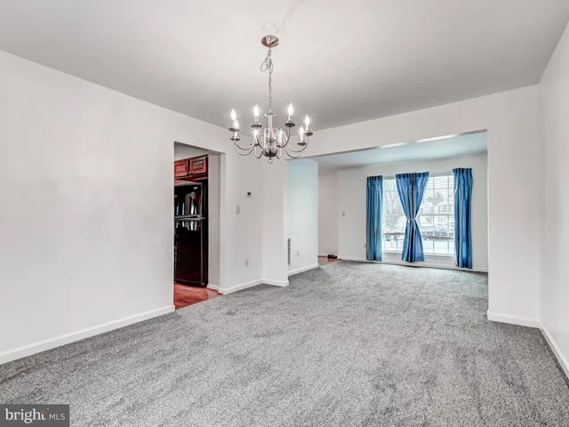 a kitchen with stainless steel appliances granite countertop a sink stove and wooden cabinets