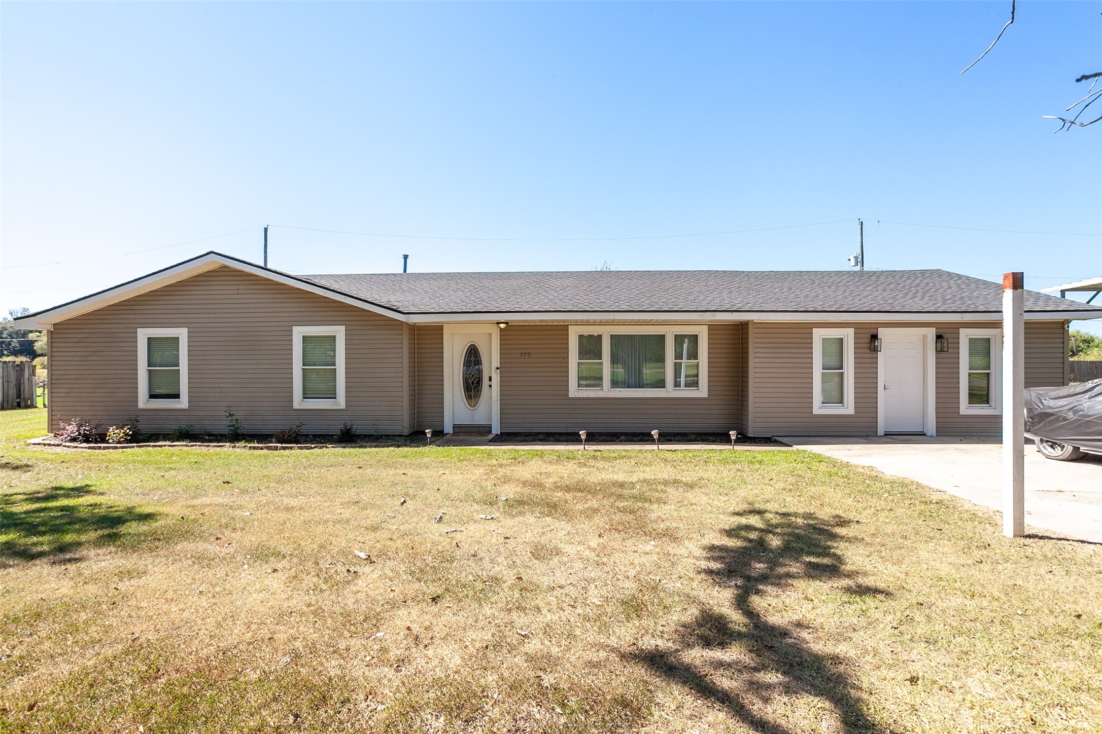 120 Mayflower Street Bridge City, TX 77611 - Photo 1 of 27 a front view of a house with a garden
