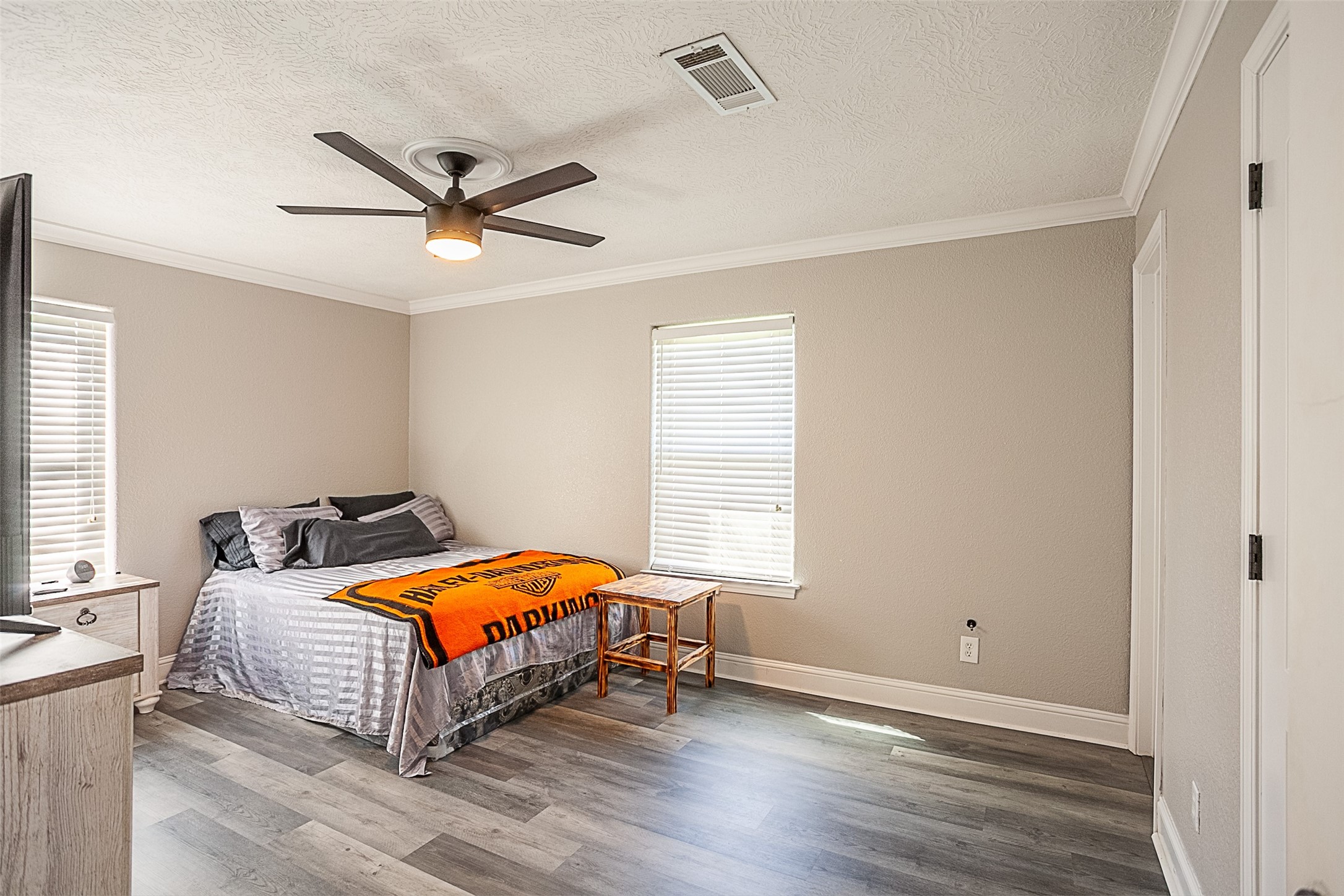 120 Mayflower Street Bridge City, TX 77611 - Photo 16 of 27 a bedroom with a bed and window