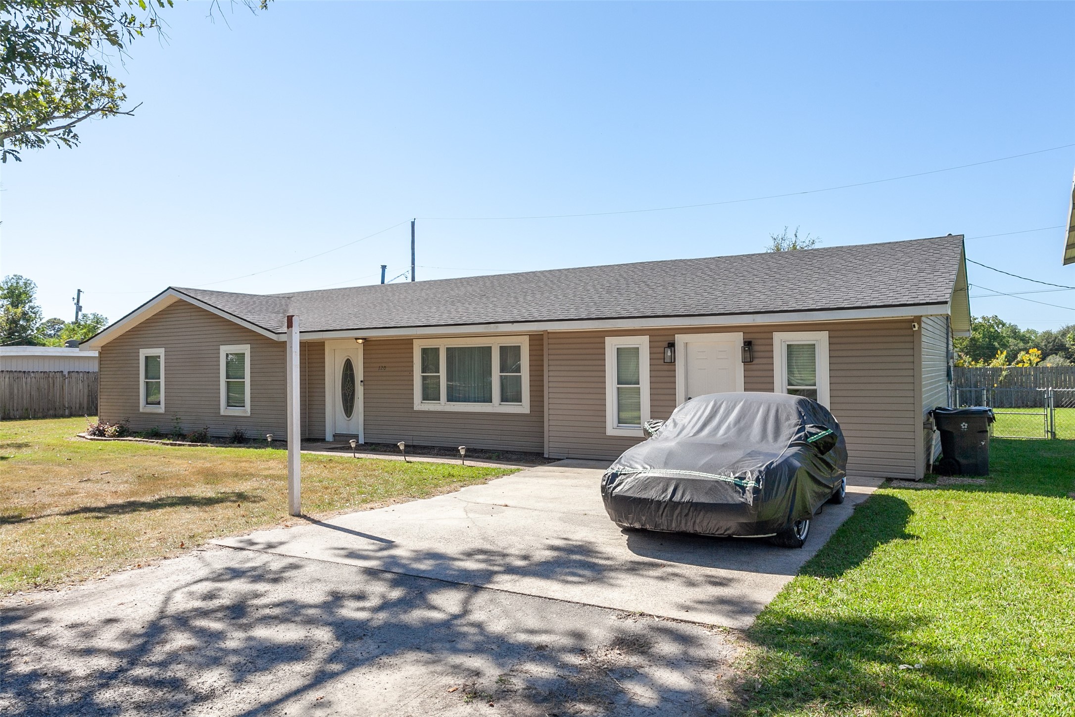 120 Mayflower Street Bridge City, TX 77611 - Photo 27 of 27 a front view of a house with a yard and garage
