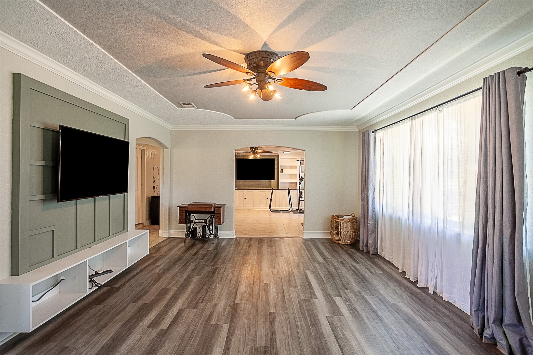 120 Mayflower Street Bridge City, TX 77611 - Photo 5 of 27 a view of a livingroom with furniture window wooden floor and a ceiling fan