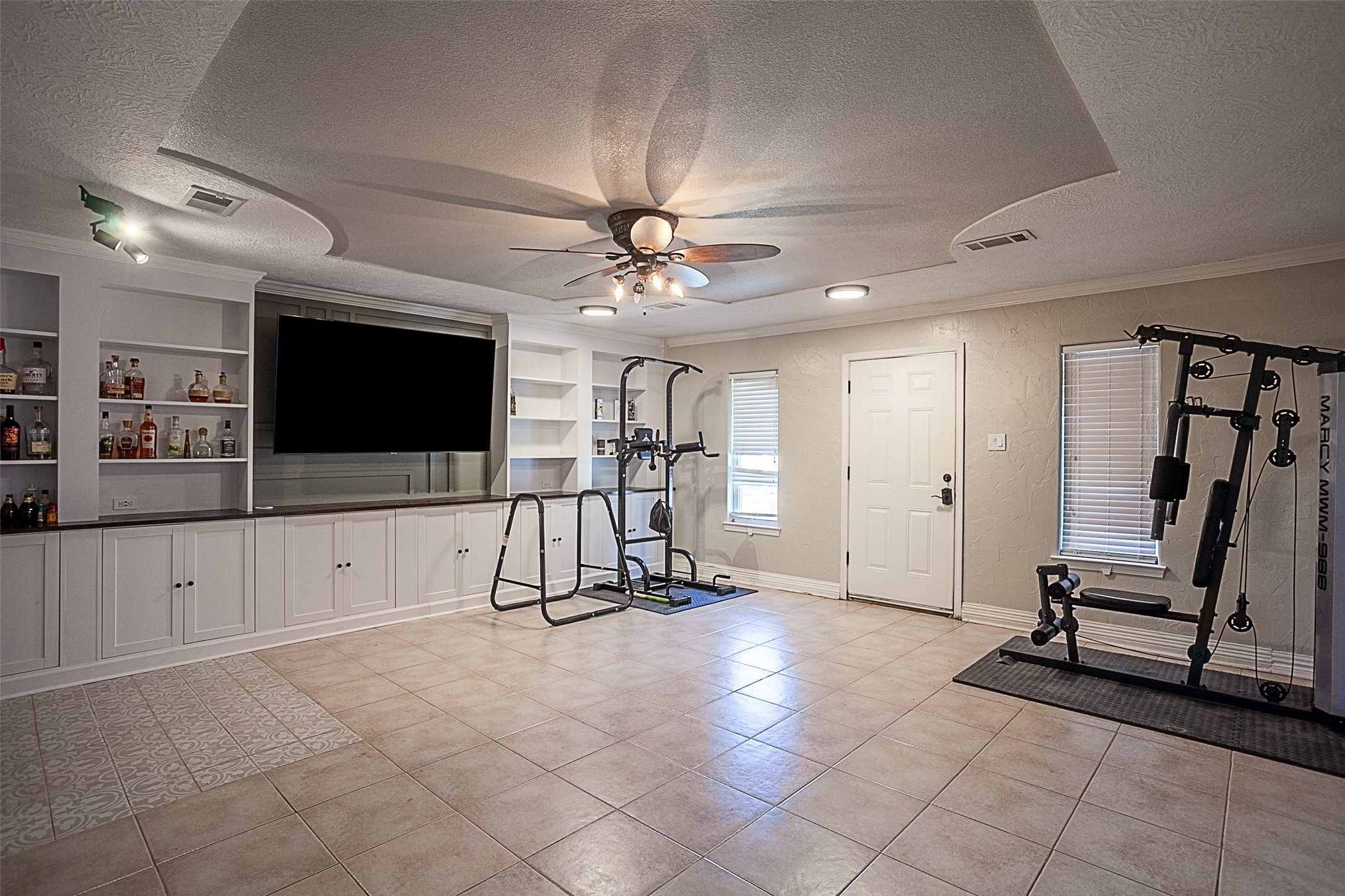 120 Mayflower Street Bridge City, TX 77611 - Photo 6 of 27 a view of a room with gym equipment and a large window