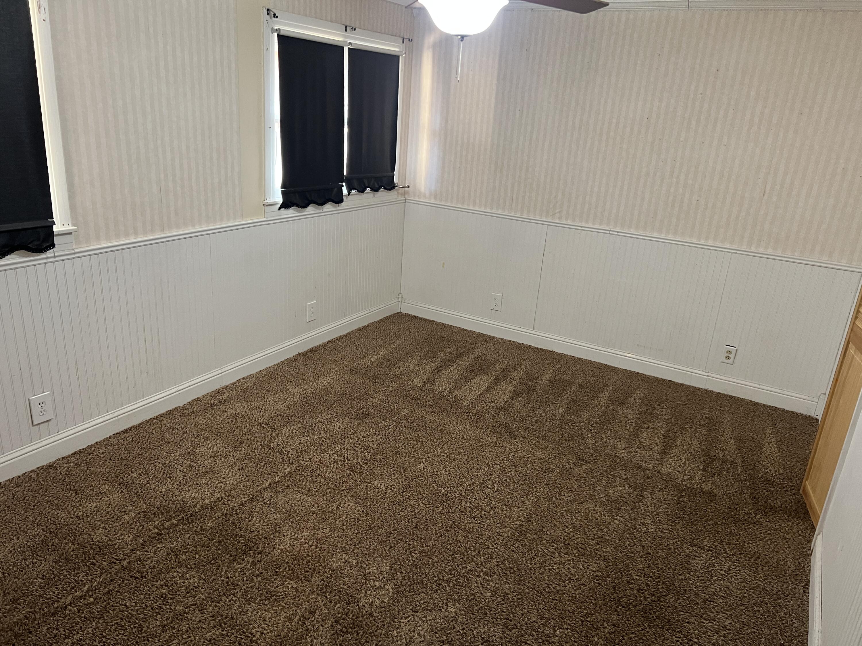 203 Northeast Alpine Plainview, TX 79072 - Photo 11 of 15 an empty room with a window
