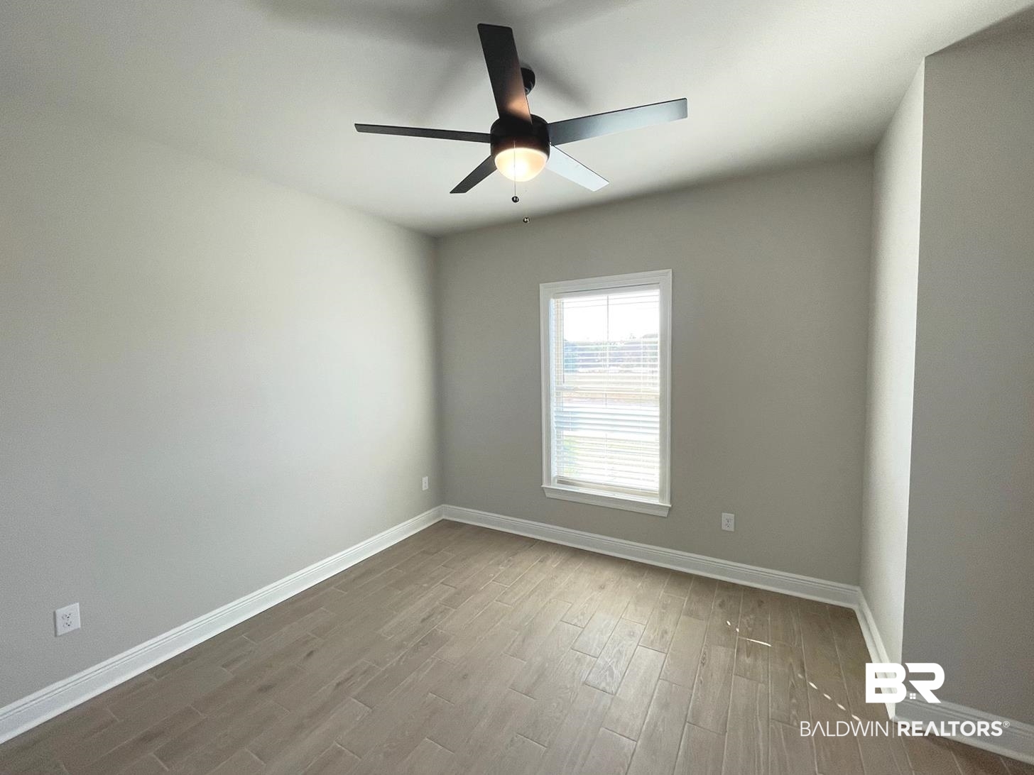1579 Fenton Circle Foley, AL 36535 - Photo 8 of 14 Spare room with hardwood / wood-style flooring and ceiling fan