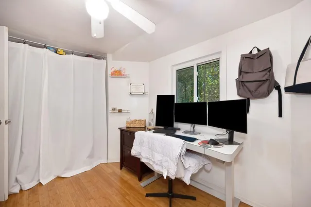 a workspace with furniture and window