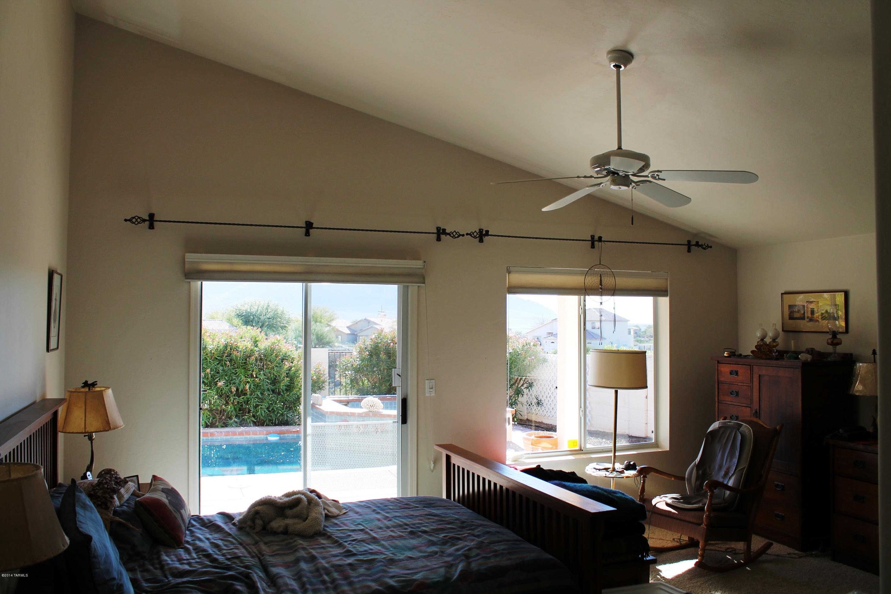 11286 North Copper Spring Trail Tucson, AZ 85737 - Photo 5 of 8 a living room with furniture and a window