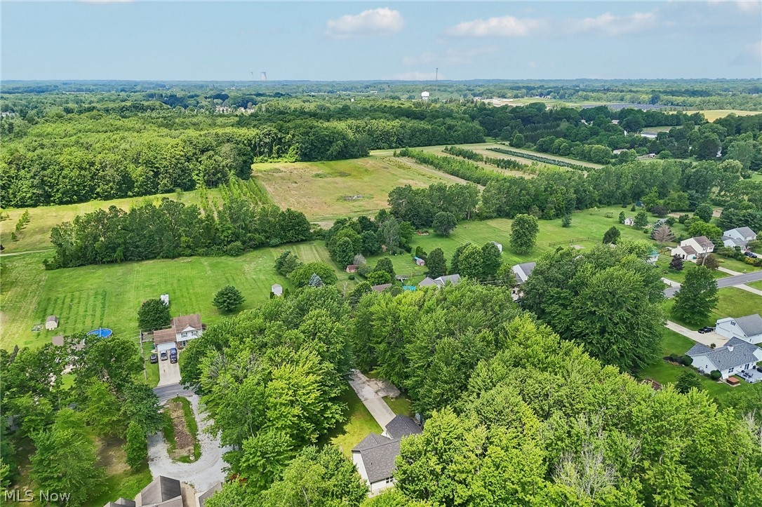 3213 Bates Road Madison, OH 44057 - Photo 3 of 45 Expansive residential area featuring abundant mature trees and verdant green spaces