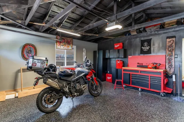 a car and bike parked in a garage