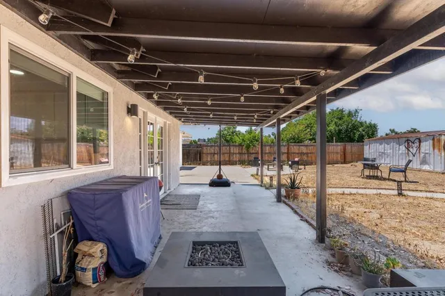 a view of living room with furniture and a garden