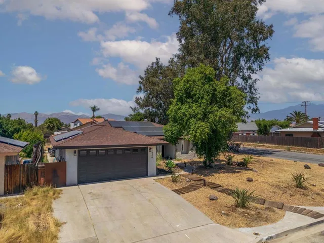 a view of a house with snow on the background