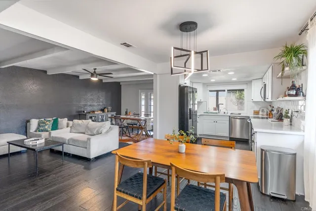 a living room with kitchen view and kitchen view