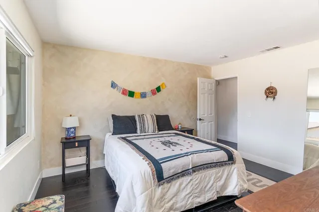 a bed room with a bed and a window