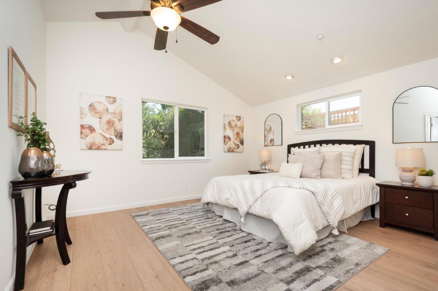 3989 Oneill Drive San Mateo, CA 94403 - Photo 14 of 47 a bedroom with a bed and a chandelier