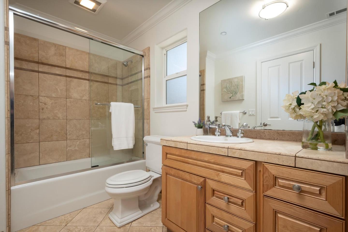 3989 Oneill Drive San Mateo, CA 94403 - Photo 16 of 47 a bathroom with a sink a toilet and shower