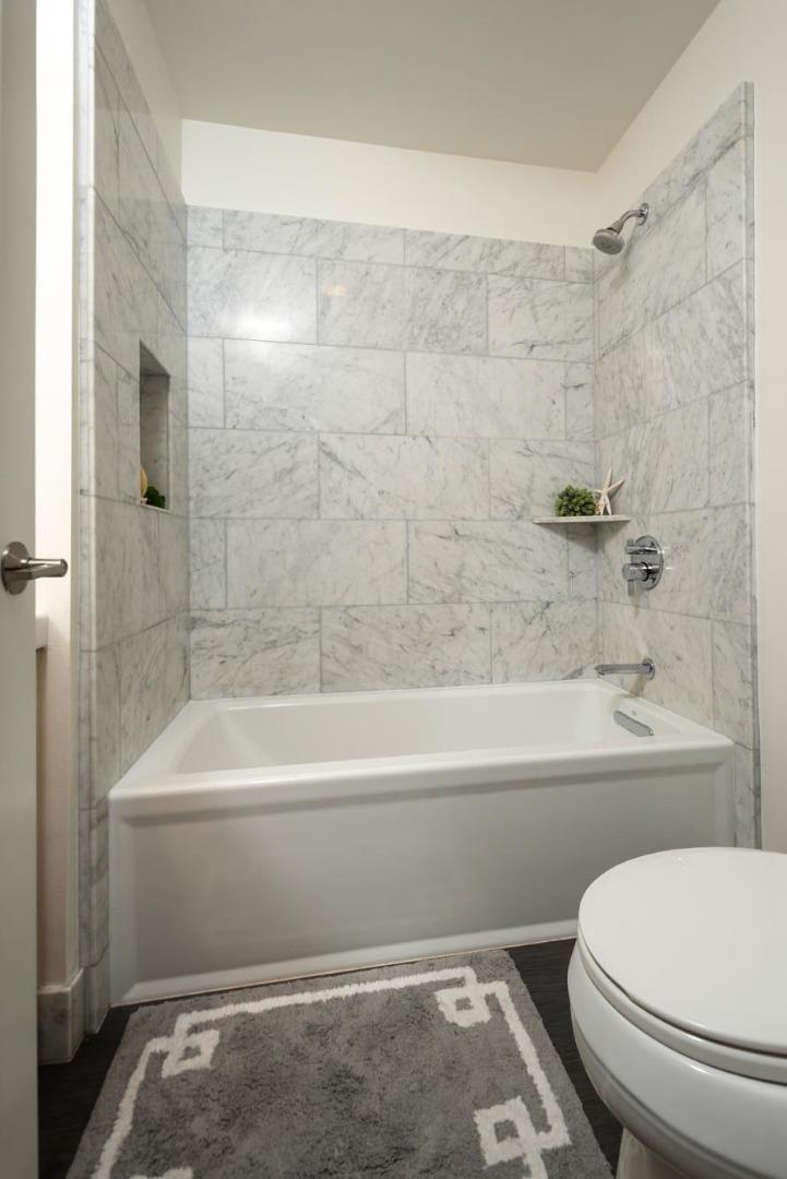 3989 Oneill Drive San Mateo, CA 94403 - Photo 22 of 47 a bathroom with a toilet and a bathtub