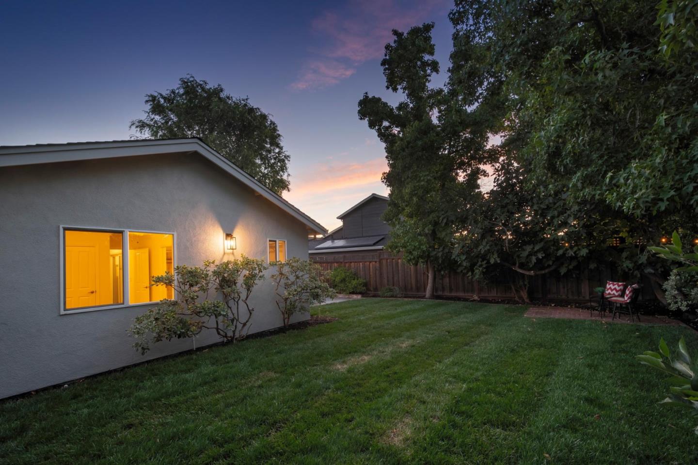 3989 Oneill Drive San Mateo, CA 94403 - Photo 33 of 47 a view of a backyard with potted plants and large trees