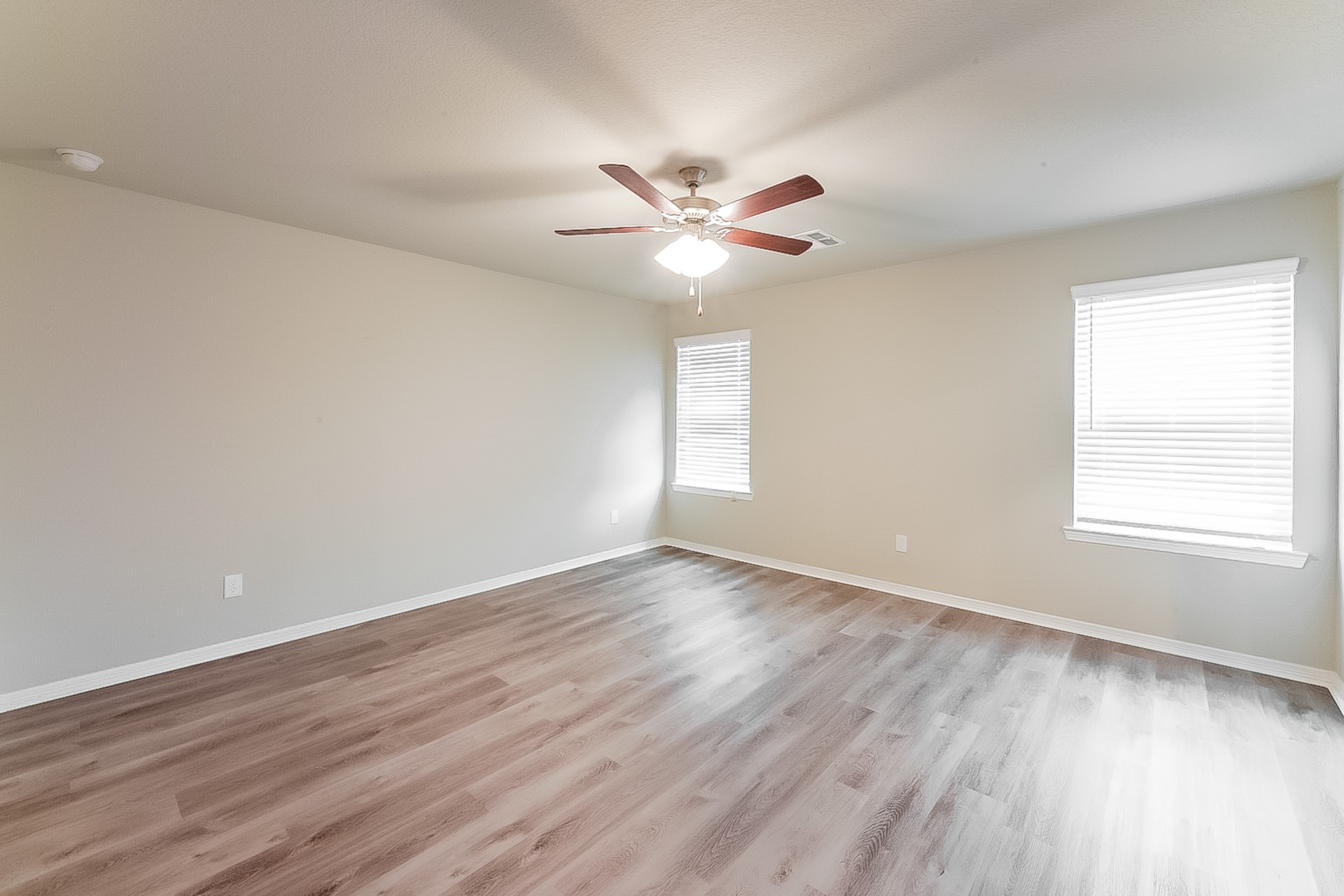 25542 Valverdant Court Porter, TX 77365 - Photo 11 of 17 a view of an empty room with window and wooden floor